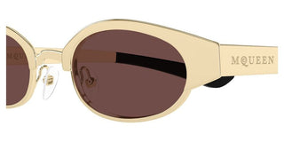 Alexander McQueen AM0545S unisex Gold Oval Sunglasses
